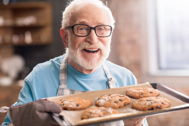 istock Senior man with cookies 683966456