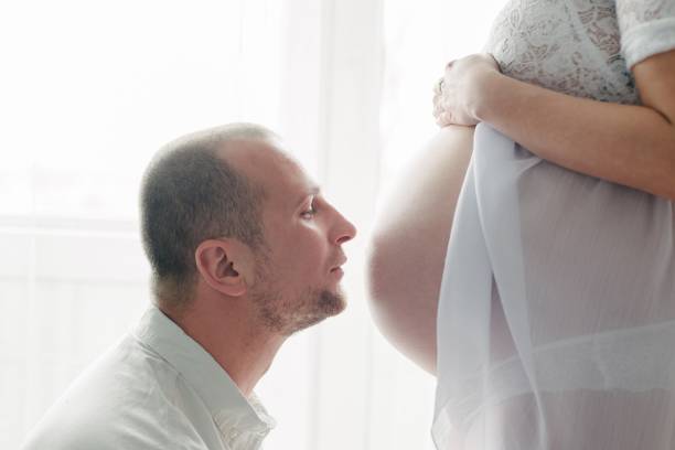 istock Happy husband kissing tummy. 683967036