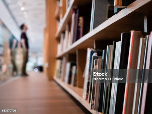 Blur People Stand Book Shelf In Public Library Stock Photo - Download Image Now - Library, Bookstore, Shelf