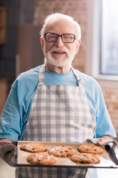 istock Senior man with cookies 683973154