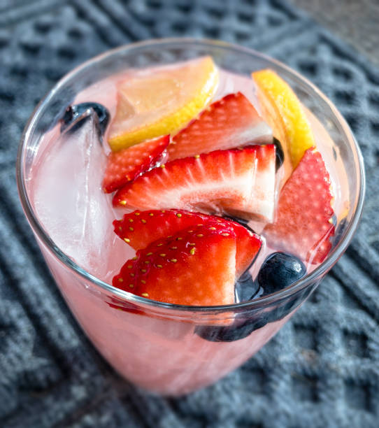istock Pink Lemonade Garnished with Fresh Fruit 683973652