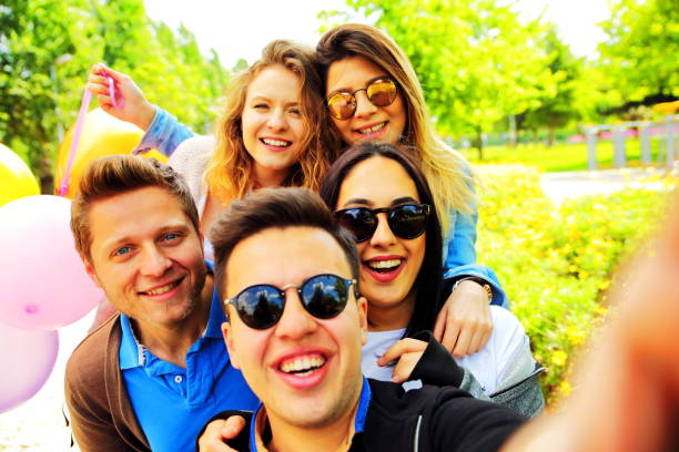 istock happy friends taking selfie 683976292