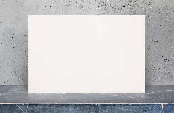istock Blank White paper poster on stone table top at grey old concrete wall,Template mock up for adding your design. 683976968