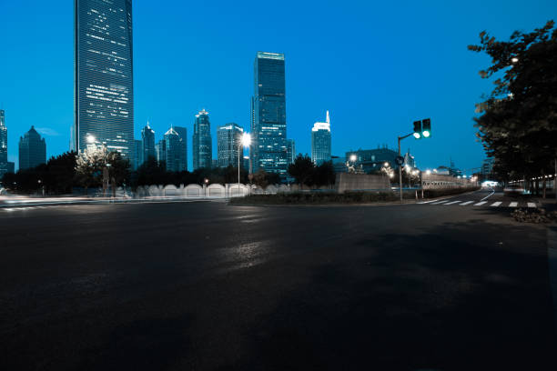 istock Empty road floor surface with modern city landmark buildings 683977306