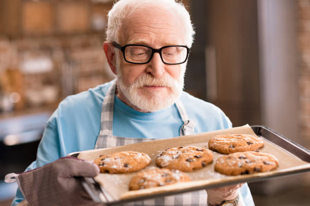 istock Senior man with cookies 683980186