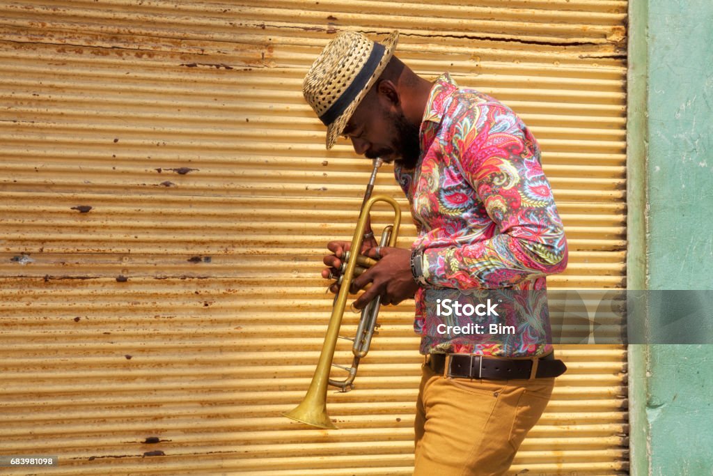 African musician playing trumpet African musician playing a trumpet in Havana, Cuba. Cuba Stock Photo