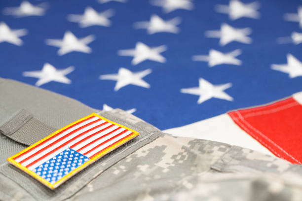 istock USA army uniform with stripe over flag - focus on stripe 683981170