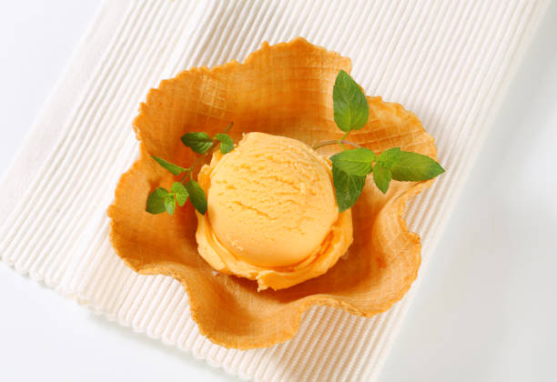 istock Orange sherbet in a waffle basket 683983582