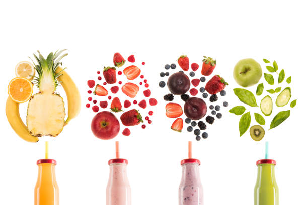 different healthy smoothies in bottles with fresh ingredients isolated on white, fresh fruit smoothie concept