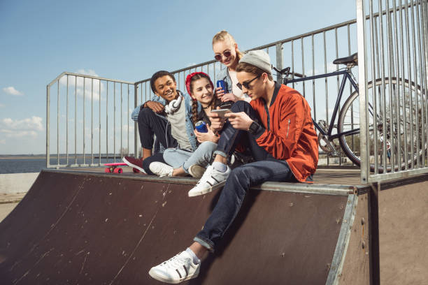 istock teenagers having fun with smartphone 683987232