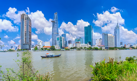 Ho Chi Minh City, Vietnam - May 1st, 2017:  Skyscrapers along river with architecture office towers, hotels, center cultural and commercial development country most in Ho Chi Minh city, Vietnam