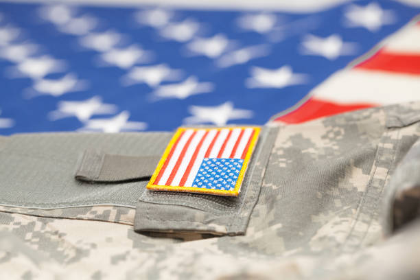 istock New USA army uniform over flag - focus on stripe 683987270