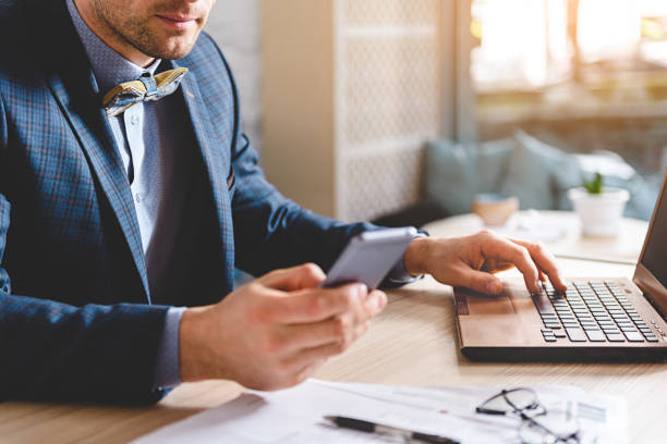 istock Businessman watching at cellphone in apartment 683988334