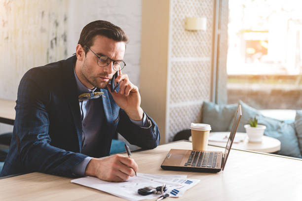 istock Serious male telling at cellphone in office 683990846