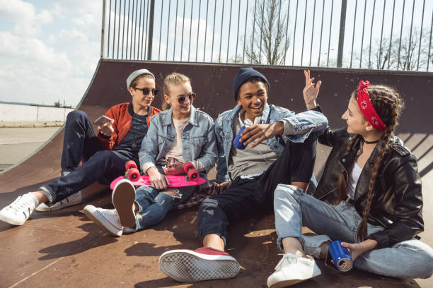 istock teenagers having fun in skateboard park 683992284