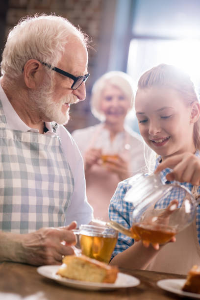 istock girl pouring tea in cup 683992312