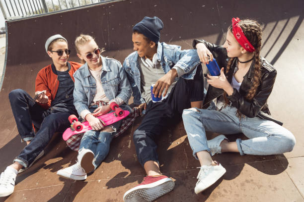 istock teenagers having fun in skateboard park 683992936