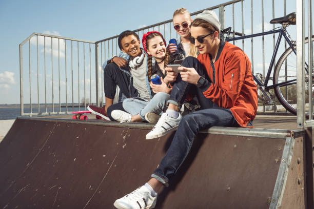 istock teenagers having fun with smartphone 683997812