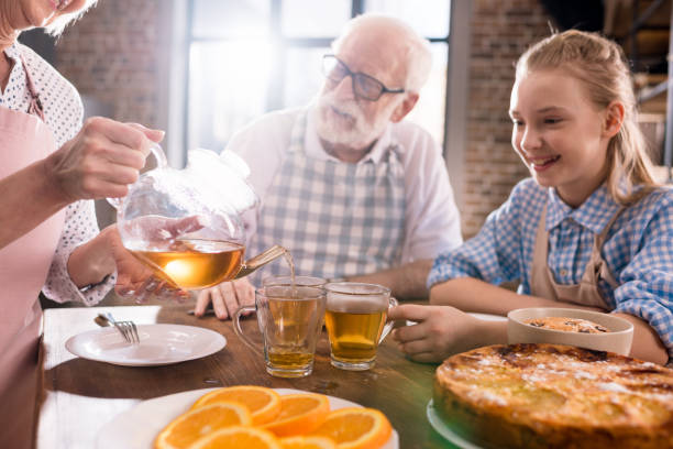 istock family drinking tea at home 683997930