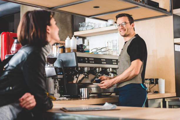 istock Outgoing male preparing mug of beverage 684000942