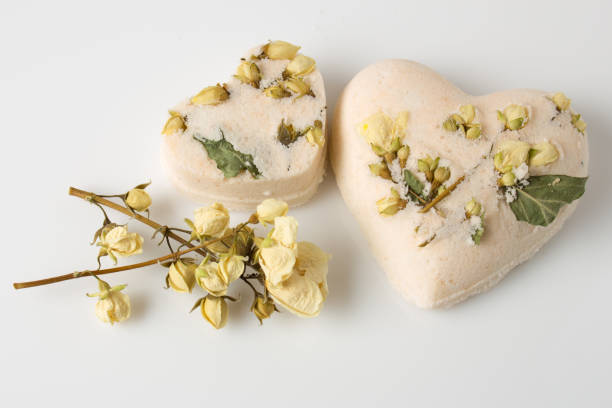istock Bath bombs decorated with dried linden flowers on a white 684008352