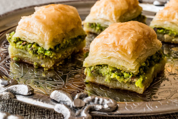 istock Turkish Dessert Baklava with pistachio on silver tray. 684014970