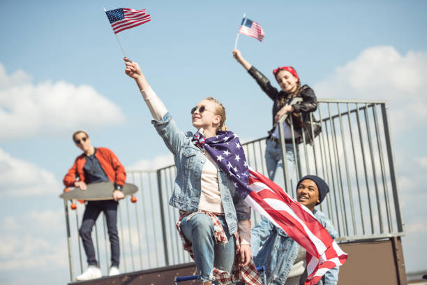 istock Teenagers waving american flags 684021118