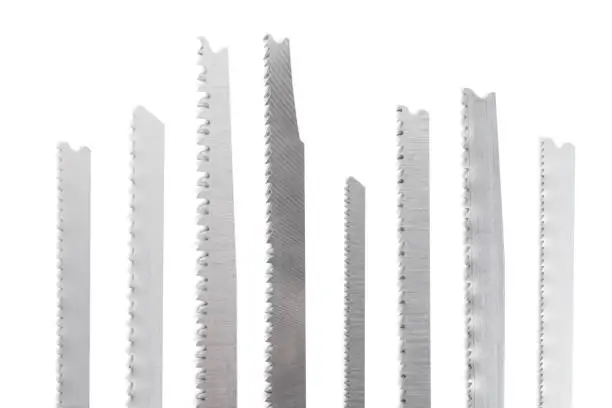 Jigsaw blades on white. This file is cleaned, retouched and contains clipping path.