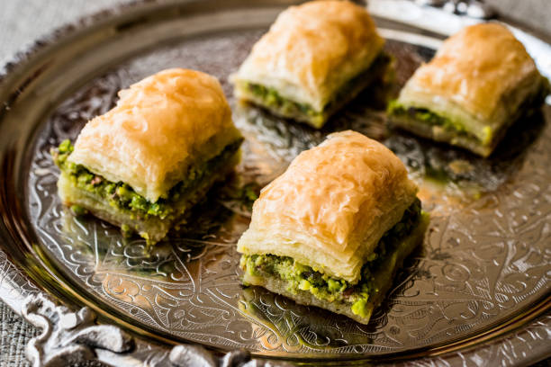 istock Turkish Dessert Baklava with pistachio on silver tray. 684021742