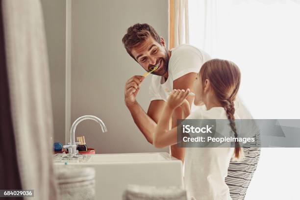 No Cavities For This Family Stock Photo - Download Image Now - Brushing Teeth, Family, Bathroom