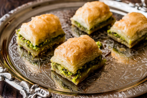 istock Turkish Dessert Baklava with pistachio on silver tray. 684030482