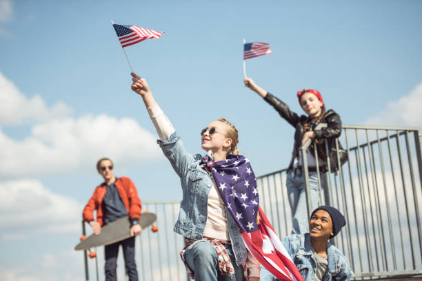 istock Teenagers waving american flags 684040334