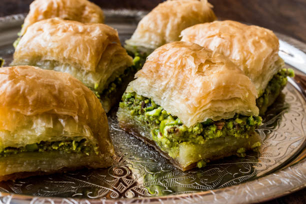 istock Turkish Dessert Baklava with pistachio on silver tray. 684040532