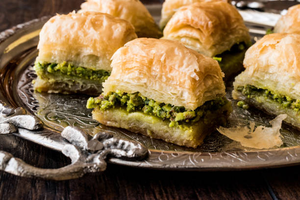 istock Turkish Dessert Baklava with pistachio on silver tray. 684041748