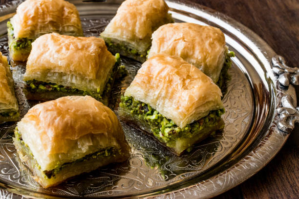 istock Turkish Dessert Baklava with pistachio on silver tray. 684043794