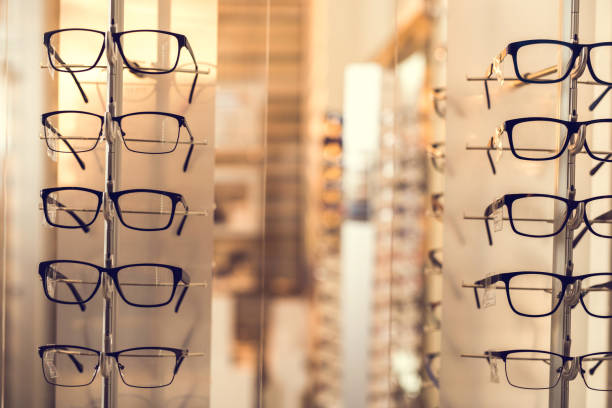 istock Large group of black eyeglasses at optician store. 684051026