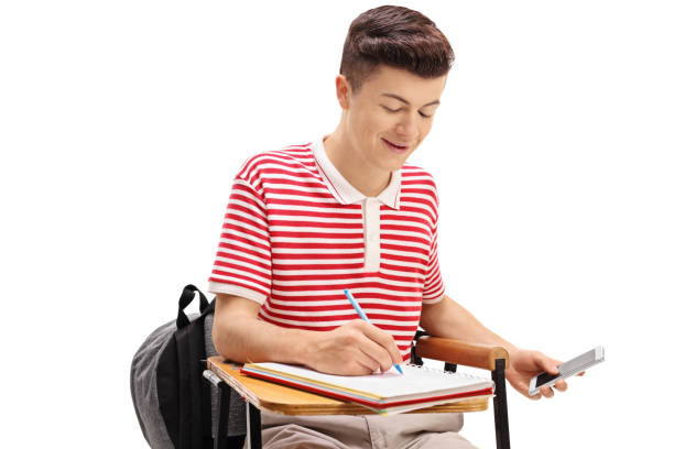 istock Teen student cheating on a test with a phone 684053932