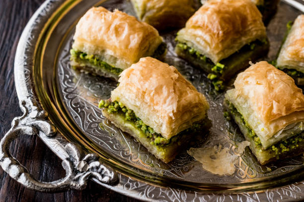 istock Turkish Dessert Baklava with pistachio on silver tray. 684054194