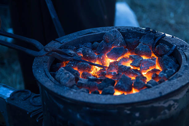 istock Forge horn with hot coals and metal horseshoe 684056780