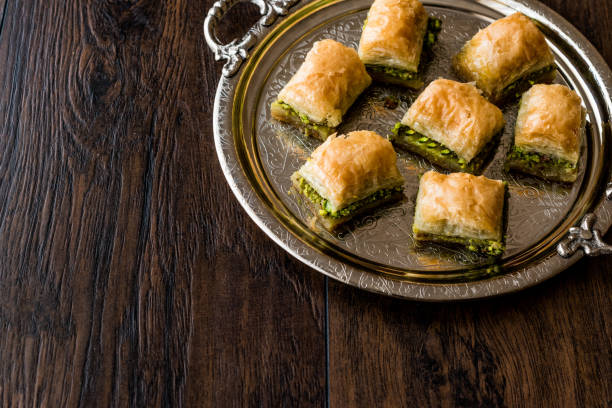 istock Turkish Dessert Baklava with pistachio on silver tray. 684057142