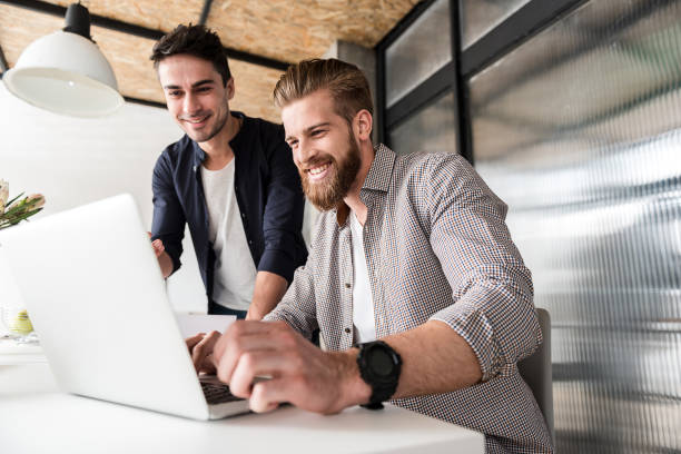 istock Happy smiling male managers in bureau 684061682