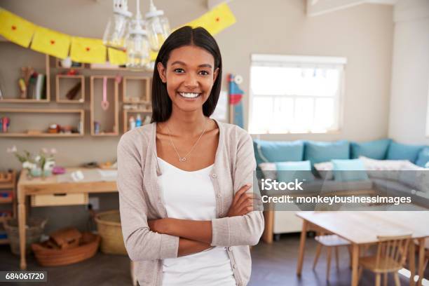 Portrait Of Female Teacher In Classroom At Montessori School Stock Photo - Download Image Now