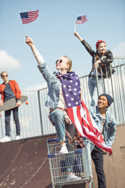 istock Teenagers waving american flags 684062266