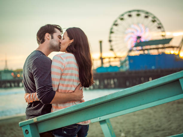 istock Happy couple spending evening on LA beach 684063330