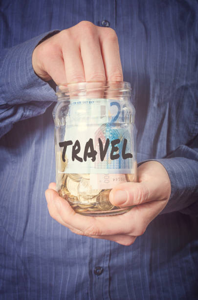 istock Travel money in glass jar 684063636