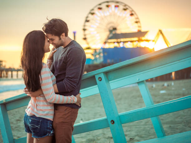 istock Happy couple spending evening on LA beach 684063900