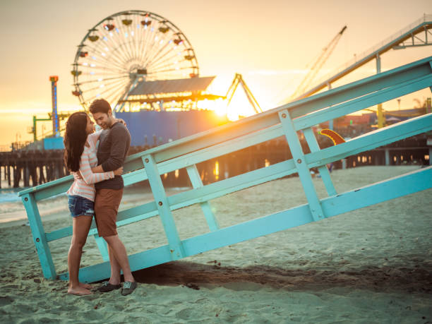istock Happy couple spending evening on LA beach 684064234