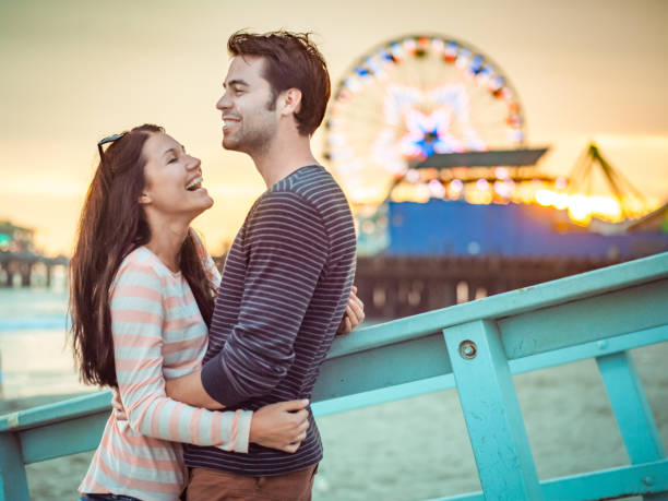 istock Happy couple spending evening on LA beach 684064406