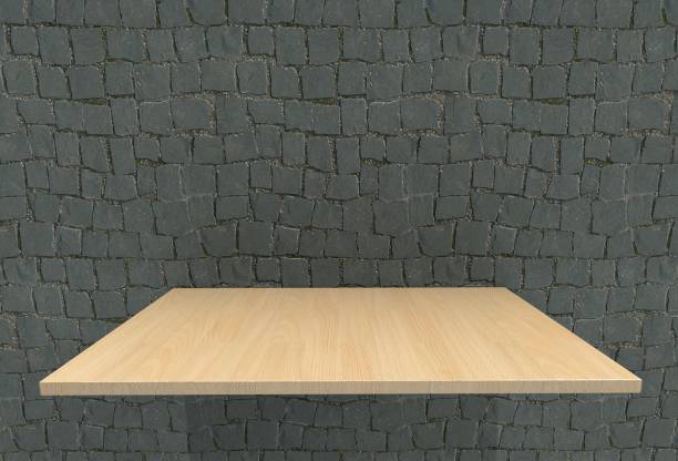 istock Empty top wood laminate floor shelves and cobblestone wall background. For product display 684069260