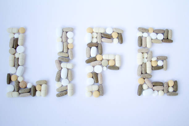 istock Colorful medical pills loose on a white background. 684069572